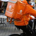 A Thuisbezorgd deliverer cycles through Maastricht. February 2022